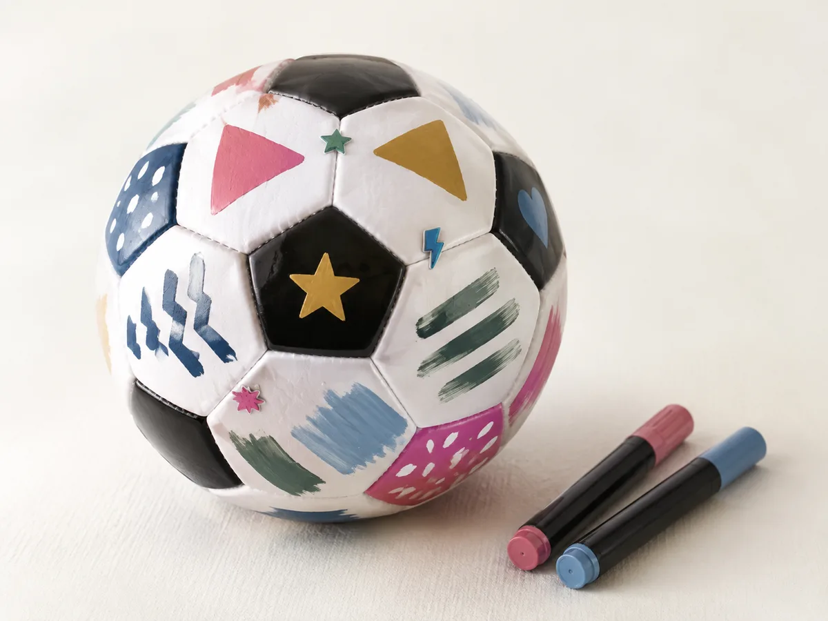 Soccer ball hand-decorated with painted shapes